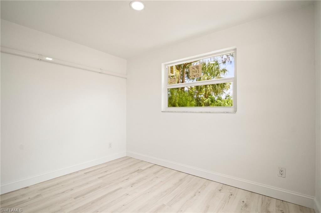 Unfurnished room with light wood-style flooring and recessed lighting