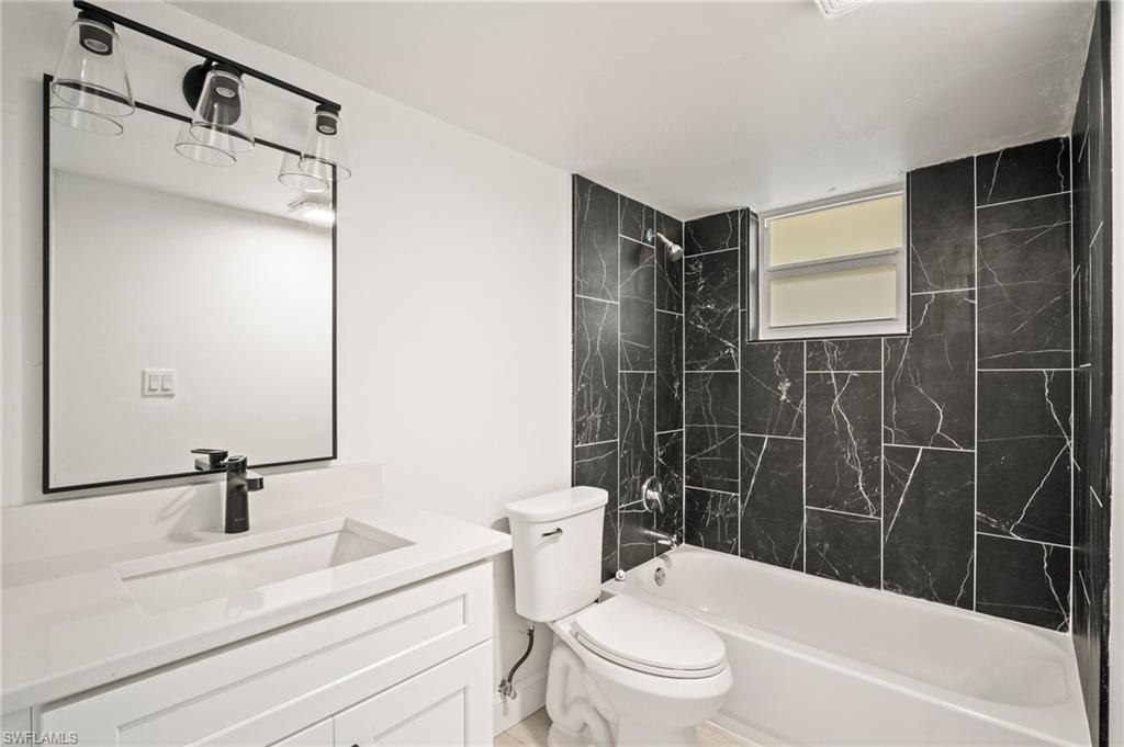 Full bathroom featuring  shower combination and vanity