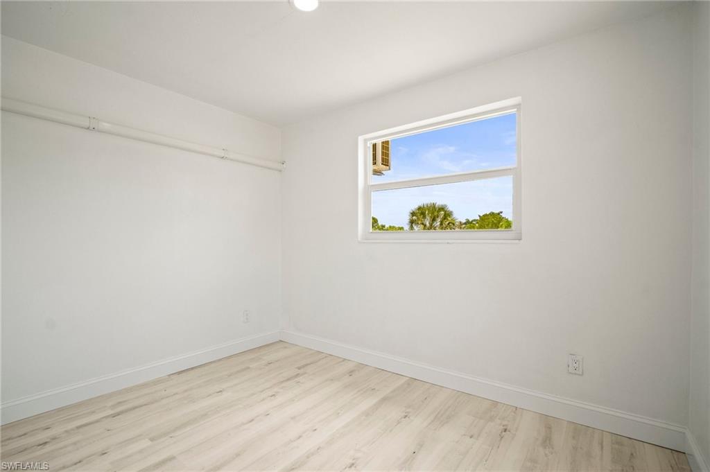 Spare room featuring wood finished floors and recessed lighting