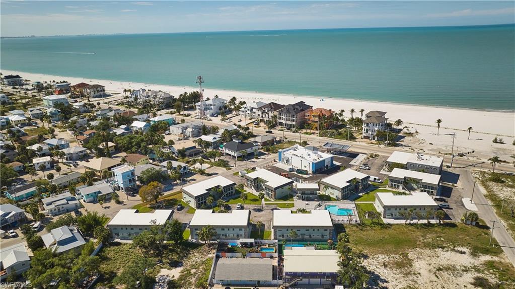 Aerial perspective showcasing a coastal community with direct beach access