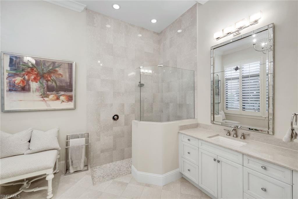 Bathroom with dual vanity and a walk in shower