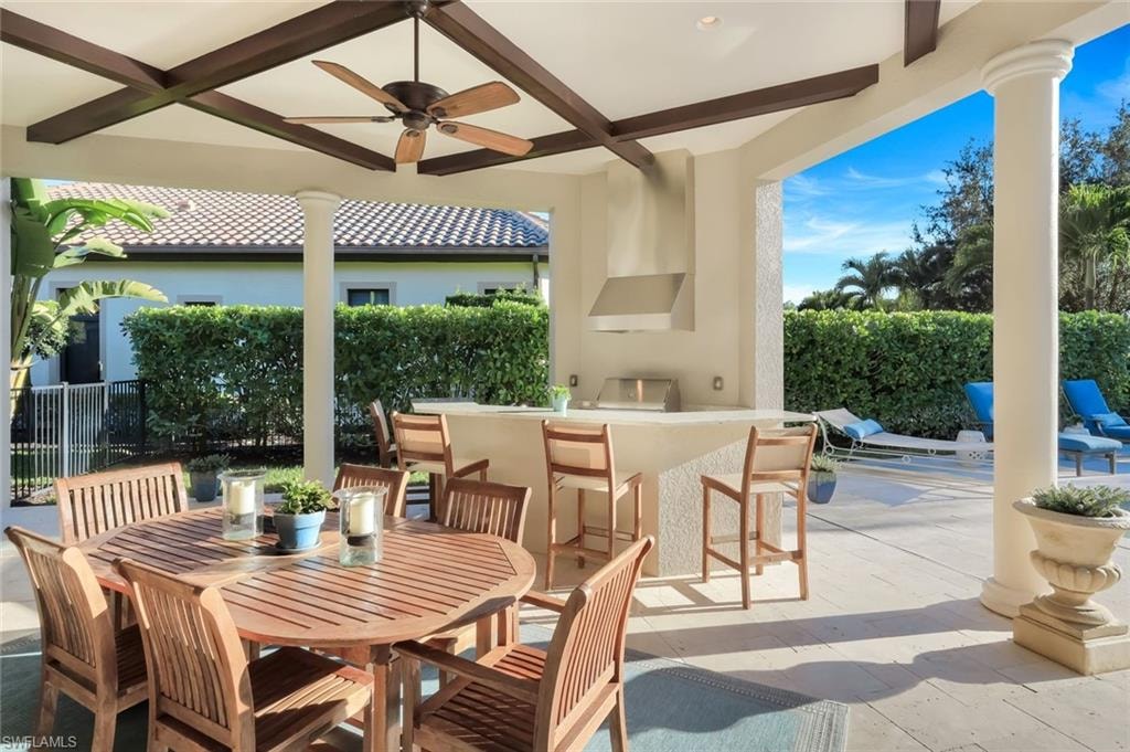 View of patio / terrace with ceiling fan, area for grilling, and outdoor dining space