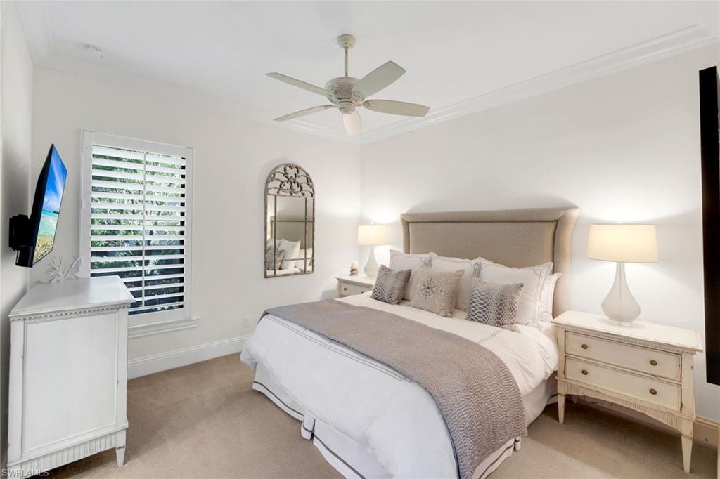 2rd Bedroom featuring king bed, carpet flooring, a ceiling fan, and crown molding