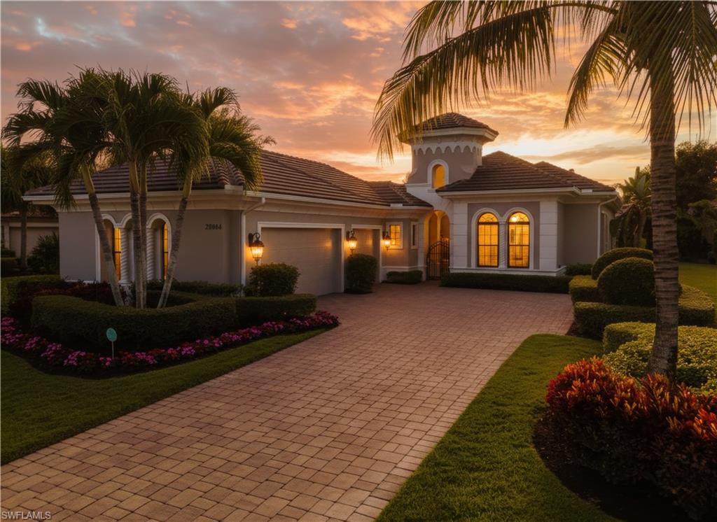 Welcome to 28864 Blaisdell - with a front yard, decorative driveway, a garage, and stucco siding