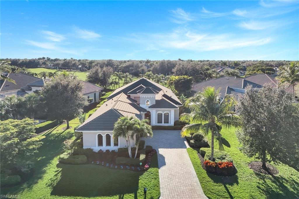 Aerial perspective of suburban area featuring a tree filled landscape