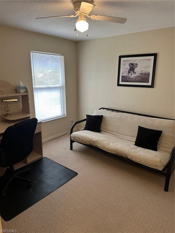 3rd bedroom with futon bed and large desk for home office
