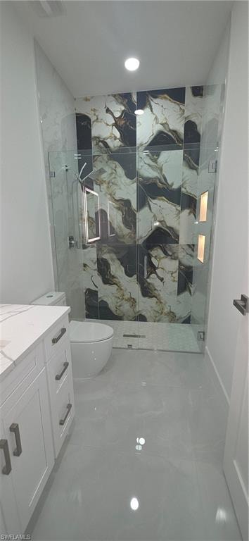 Contemporary bathroom featuring a spacious glass-enclosed shower with black and white patterned tile, integrated shower niches with lighting, a modern commode, and a white vanity with a light-toned countertop