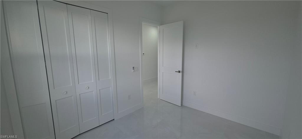 White bi-fold closet doors with panel detailing