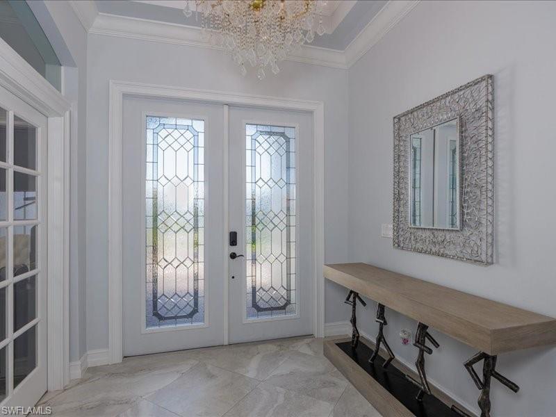 Double entry doors with decorative etched glass panels