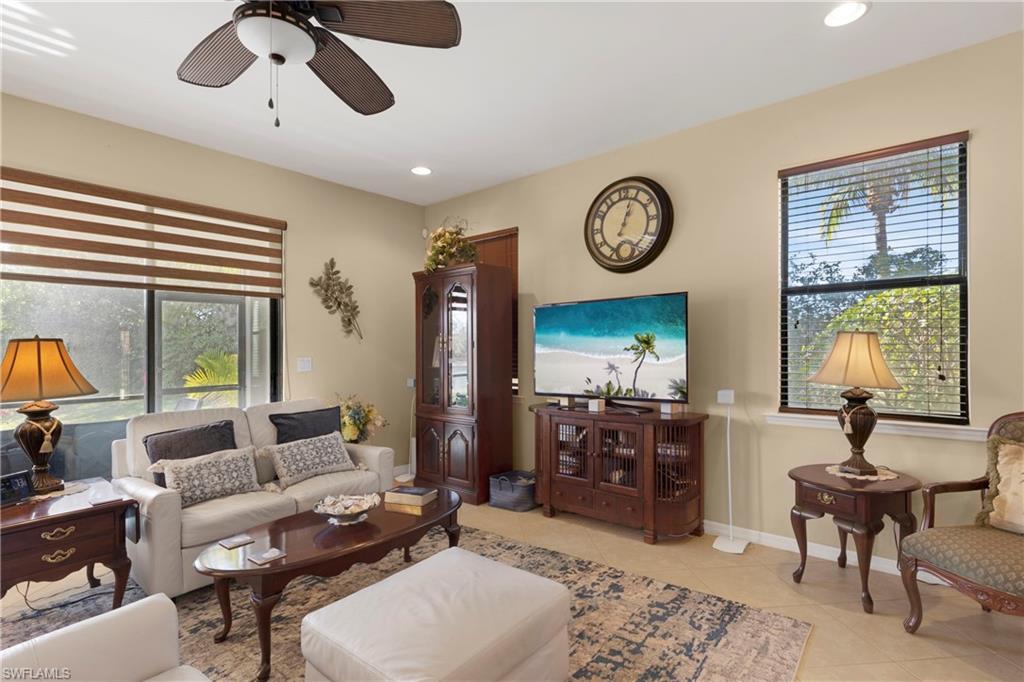 Tiled living room featuring ceiling fan