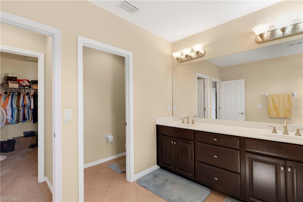 Bathroom featuring vanity and tile patterned flooring