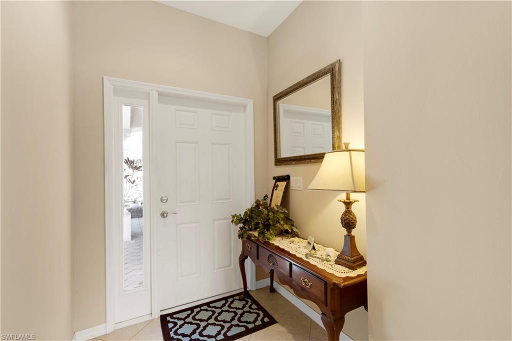 Entrance foyer featuring light tile patterned floors