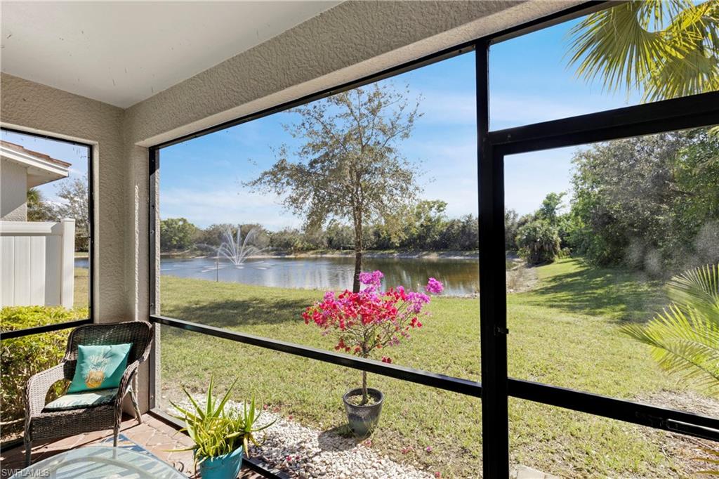 Unfurnished sunroom featuring a water view