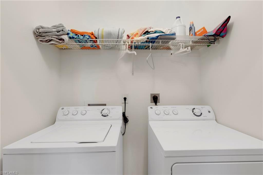 Washroom featuring washer and clothes dryer