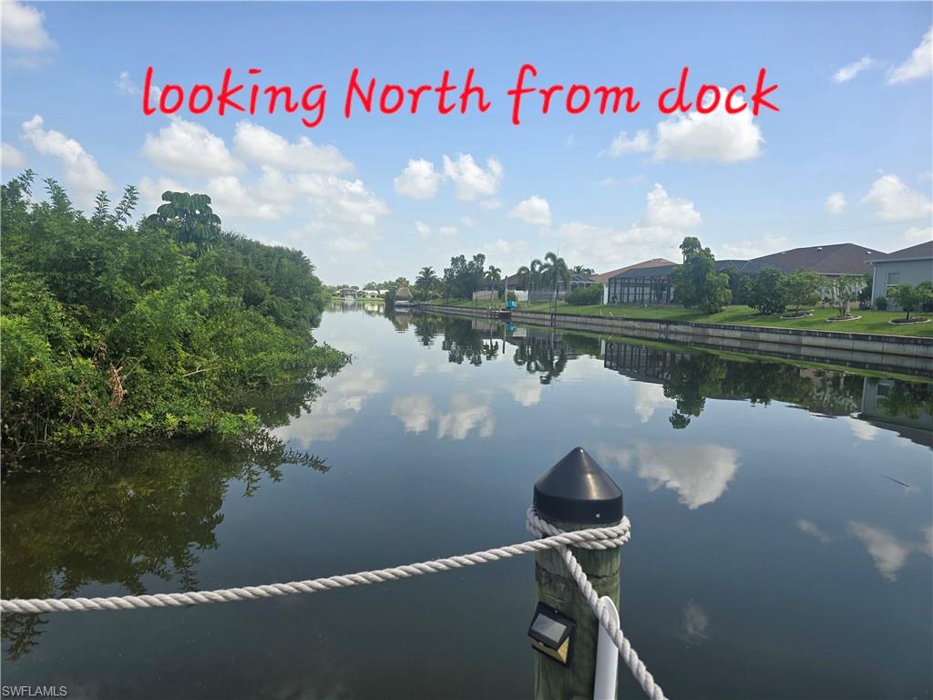 Waterfront canal with a wooden dock post and rope