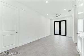 Hallway with baseboards and recessed lighting