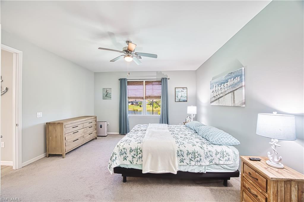 Master bedroom with view of the pool and the lake