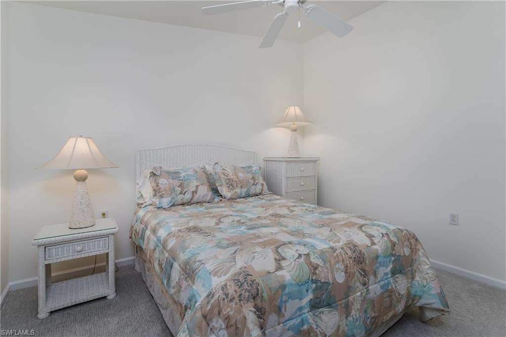 Light-colored room featuring neutral walls and grey carpeting