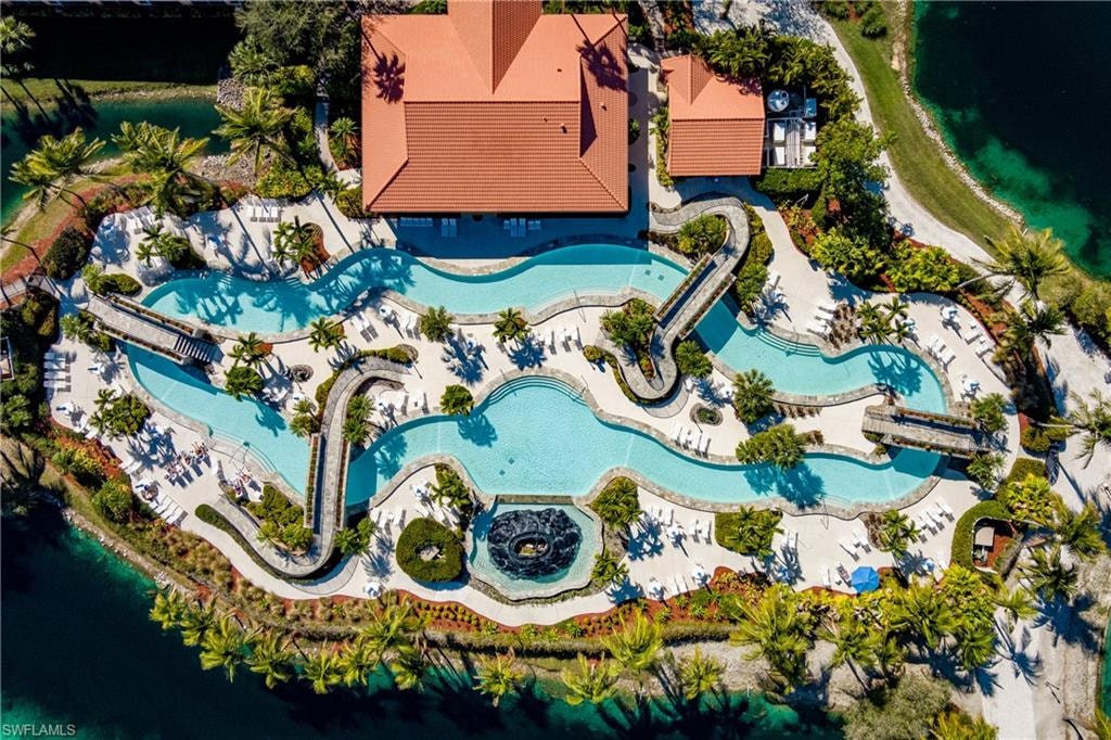 Expansive aquatic amenity featuring multiple pools and a winding lazy river