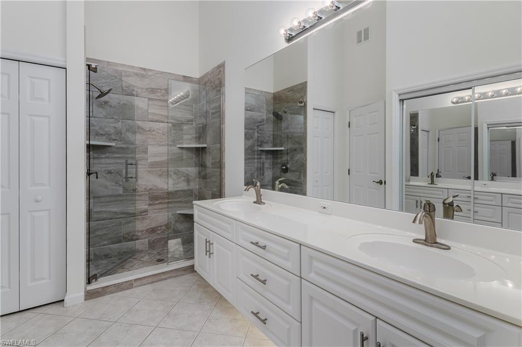 Dual vanity with undermount sinks, brushed nickel faucets, and a full-width mirror