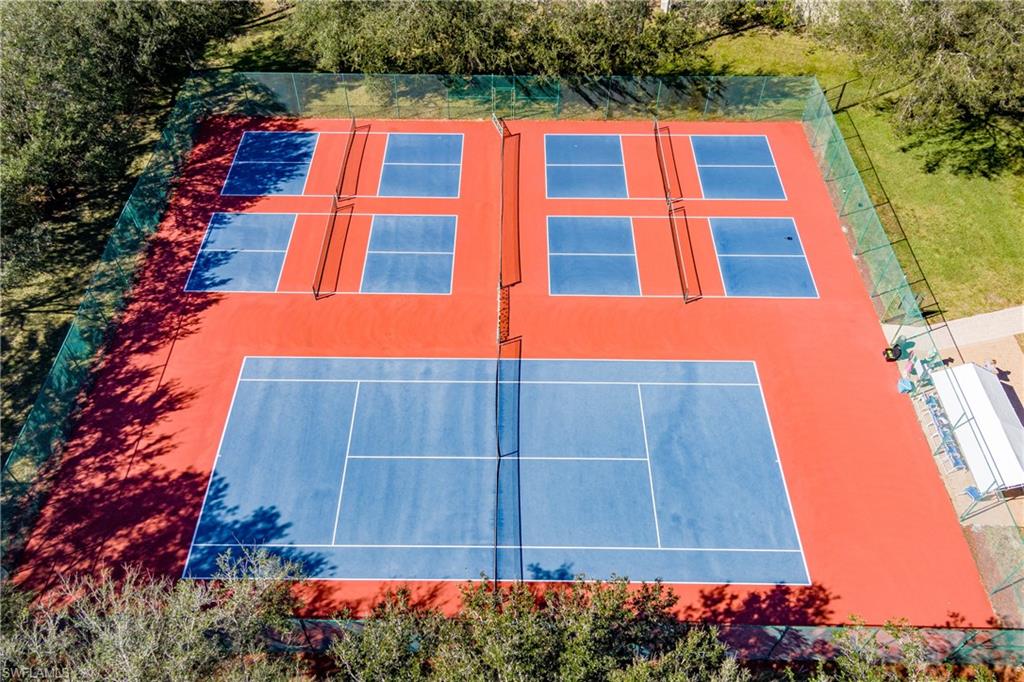 Multi-sport court area featuring one full-size tennis court and four pickleball courts