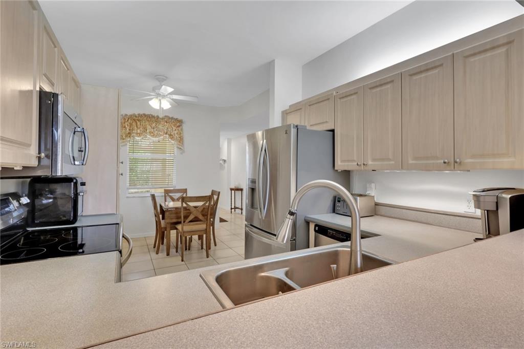 Features stainless steel appliances, sink and upgraded faucet