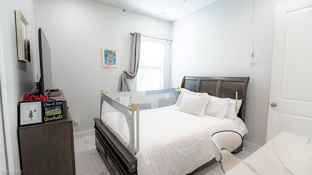 Neutral-toned walls complement the tile flooring