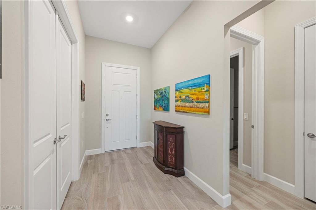 Hall with light wood-style floors