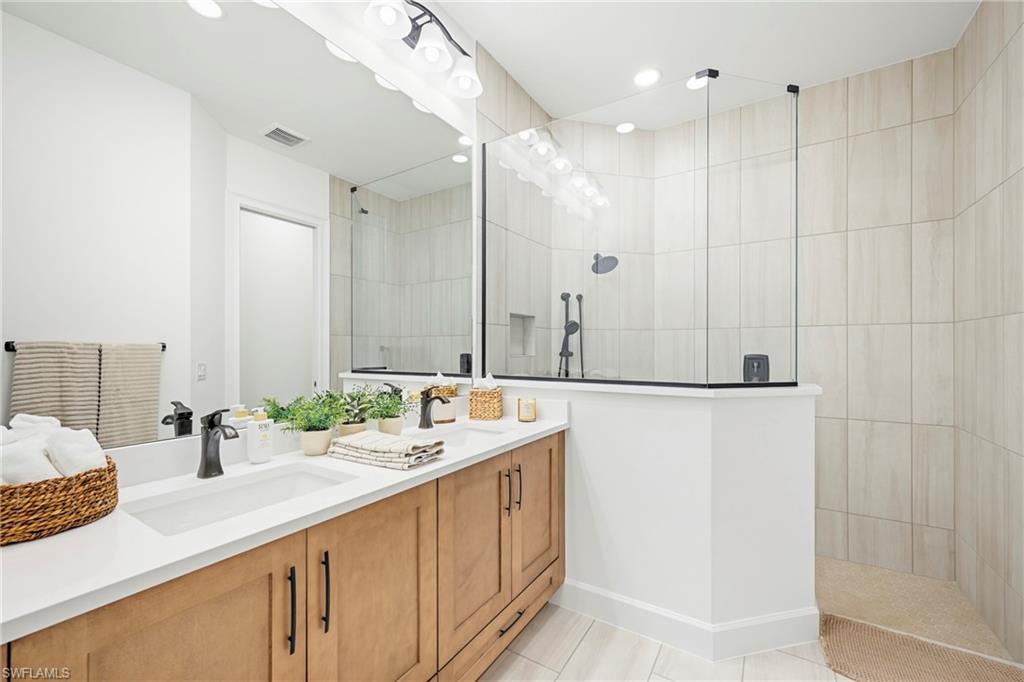 Dual vanity with integrated sinks, quartz countertop, and matte black fixtures