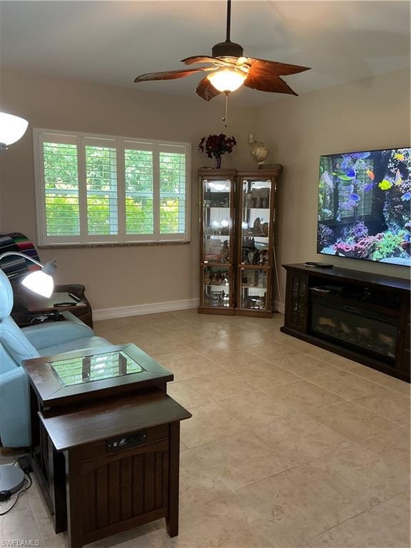 Family Room with plantation shetters on window and more light at other end from glass sliders.