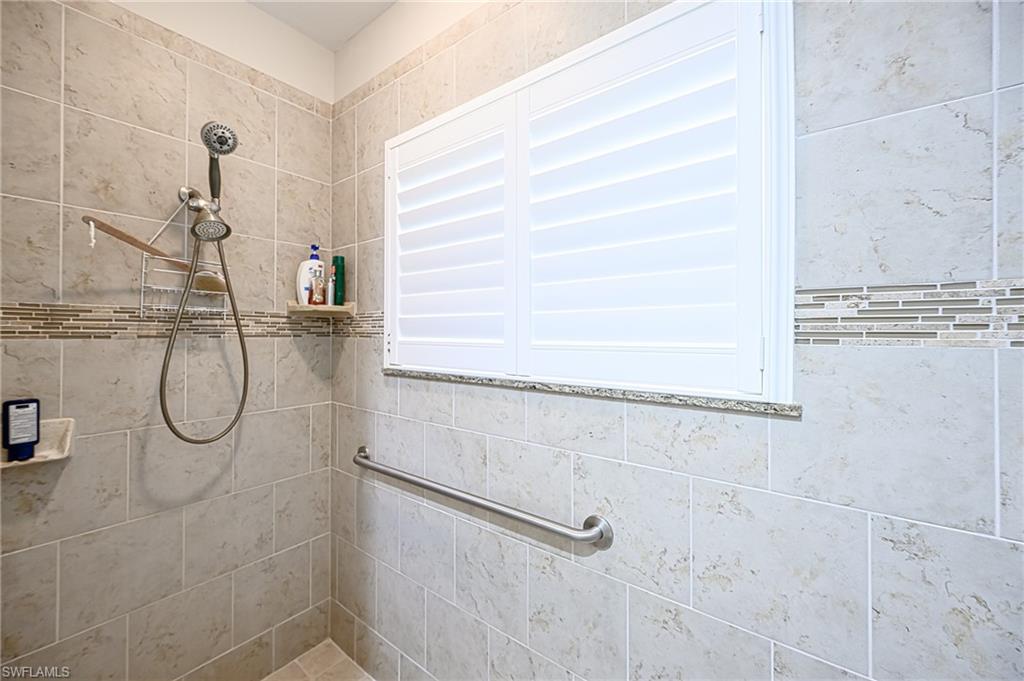 Beautiful walk in tiled shower and separate    toilette room completes the primary bath