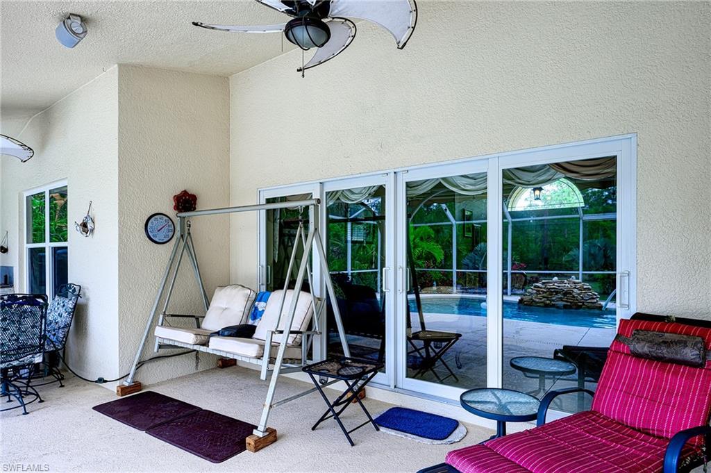 Patio with double swing , lights, fan and awning for sun protection.