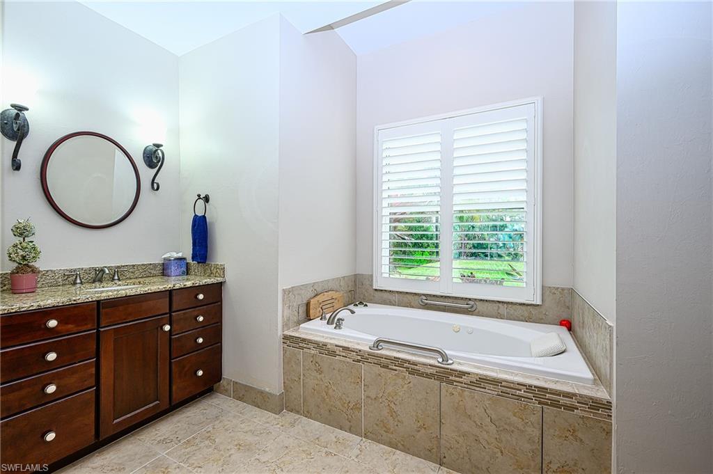 A second vanity and separate toilette room