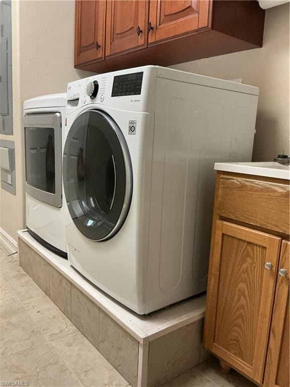 Custom built stands for washer and dryer. Laundry sink and cabinets