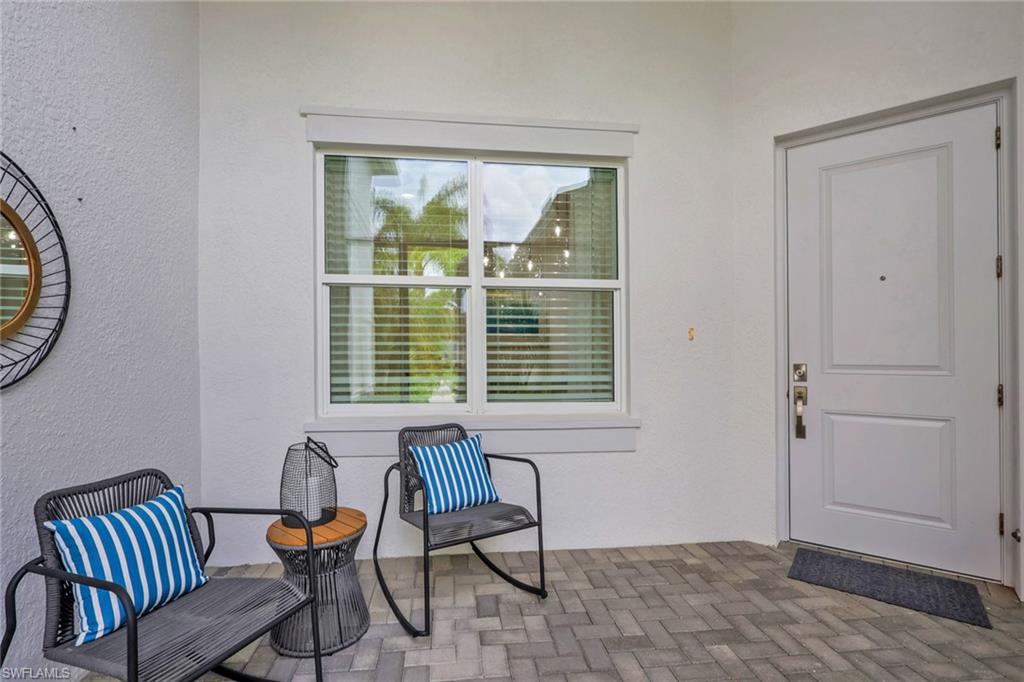 Covered entry with gray paver flooring
