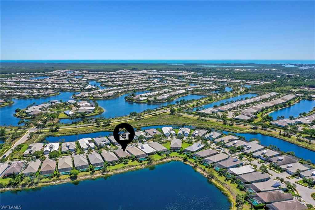 Aerial perspective showcasing a residential community with numerous homes