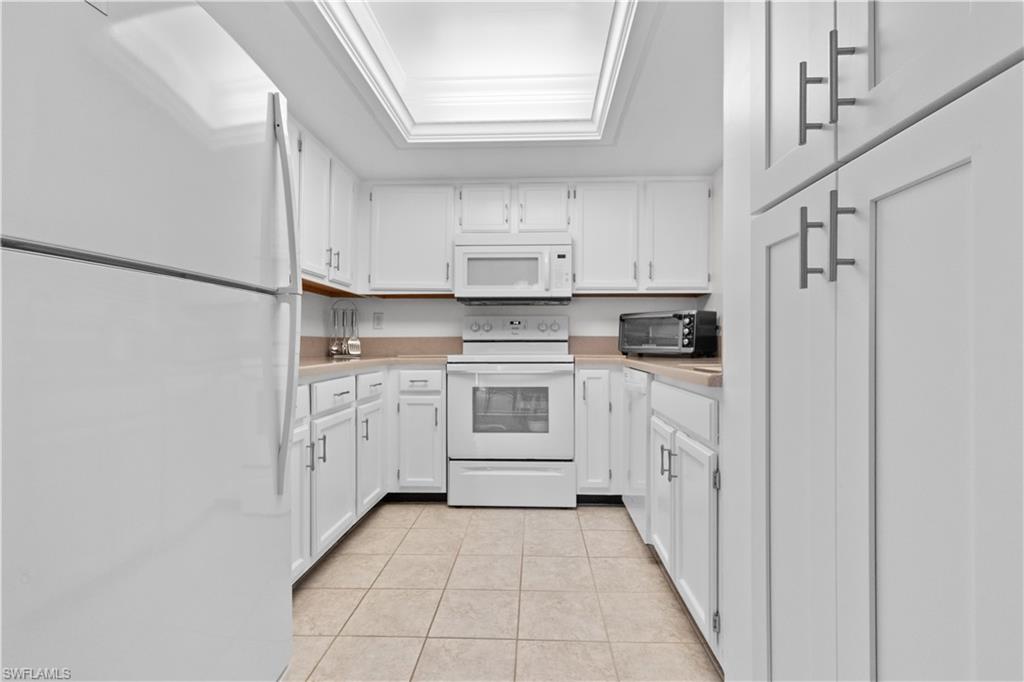 Kitchen featuring white cabinetry with brushed nickel hardware.