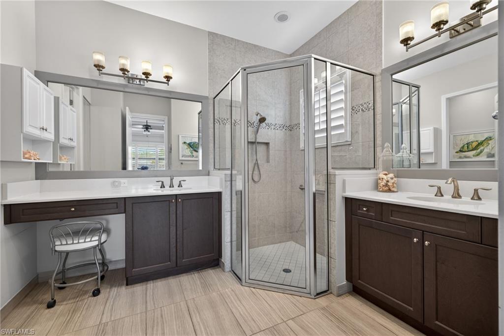 Vanity area, double vanities, corner shower and more of those gorgeous plank tile!