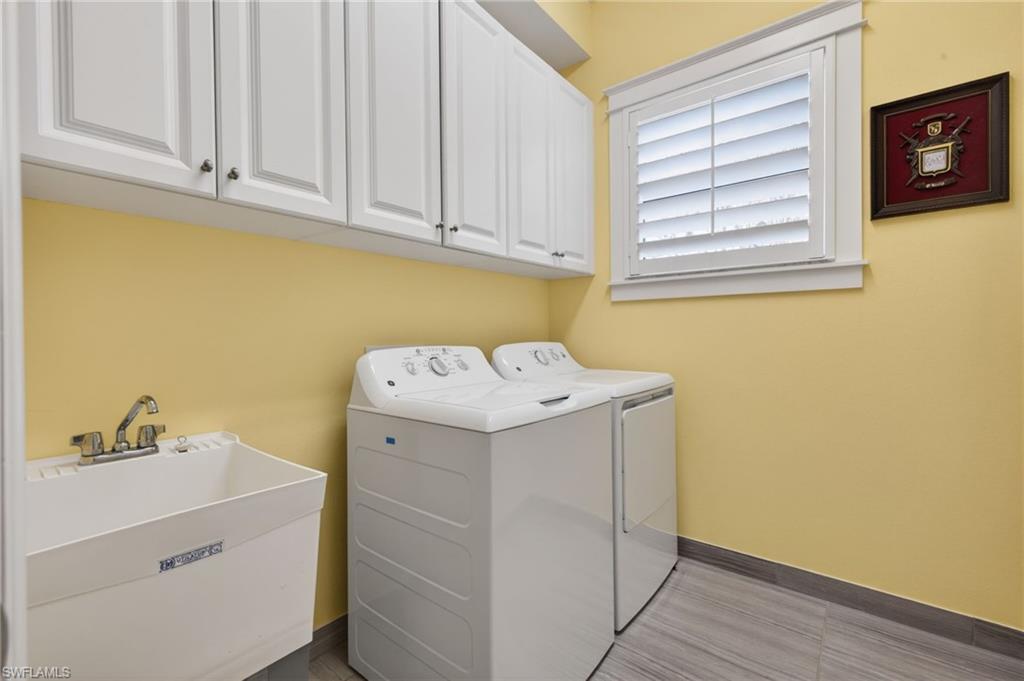 Lots of cabinets for storage and  a laundry tub here!