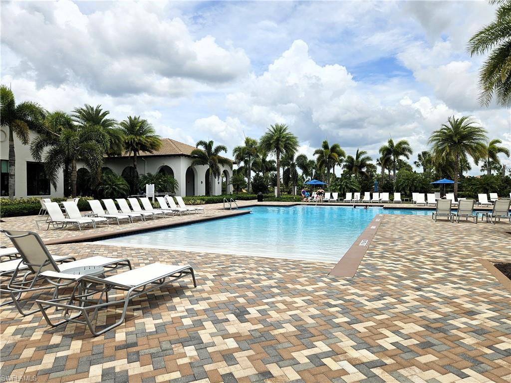 Community pool featuring a patio