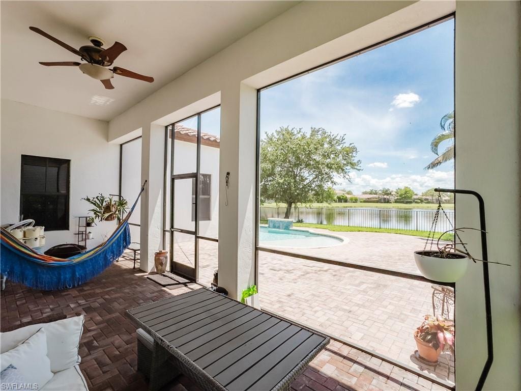Sunroom with a water view