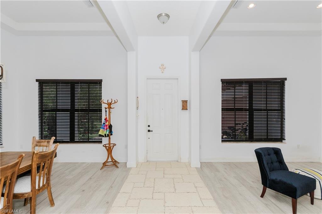 Entrance foyer featuring light wood finished floors and recessed lighting