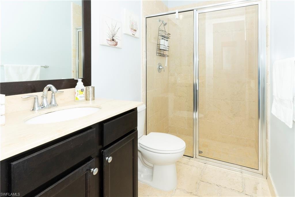 Full bath featuring vanity and a stall shower