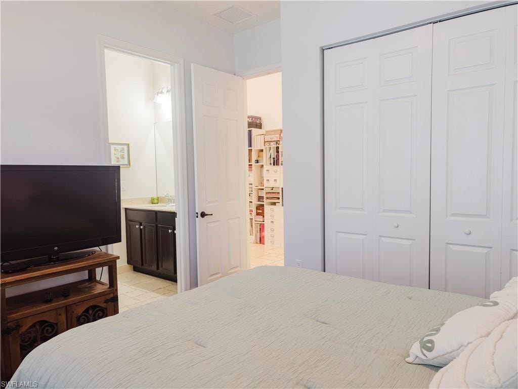 Bedroom with a closet and ensuite bathroom