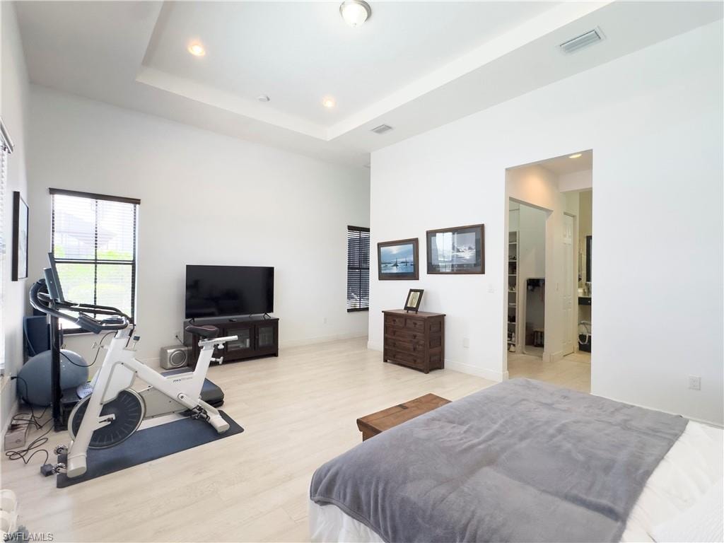 Bedroom featuring wood finished floors and recessed lighting