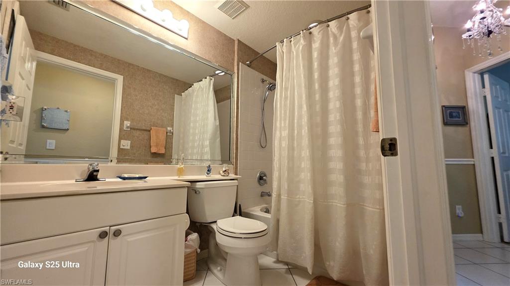 Guest Bath offers a tiled shower & 2 entry doors!