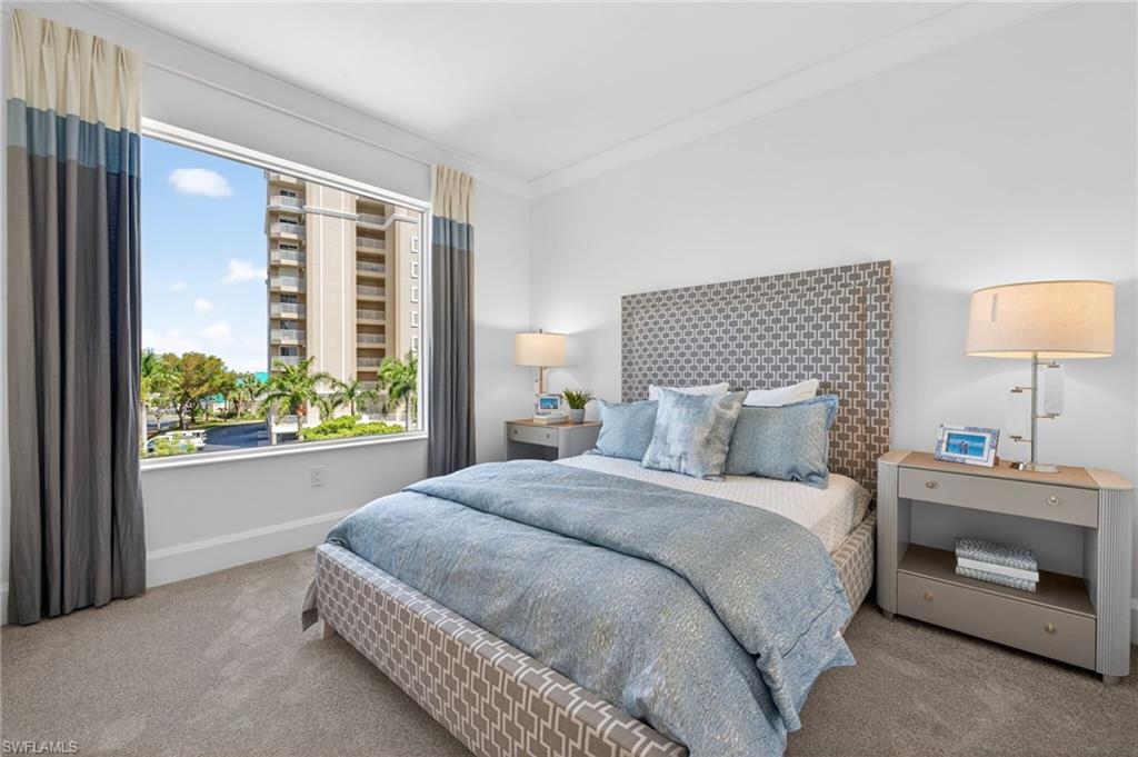 Bedroom 3 with light carpeting ,and large window for natural light