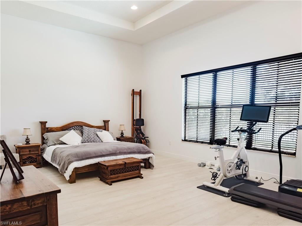 Bedroom featuring wood finished floors and recessed lighting