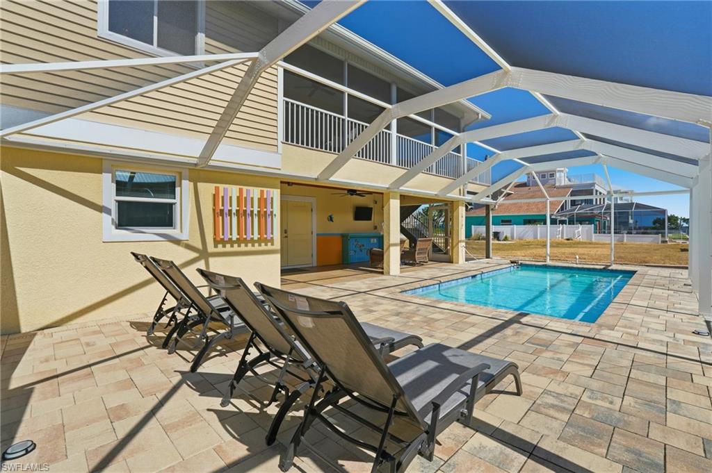 View of Pool, Patio, and Screened-in Lanai - Virtually Edited Image