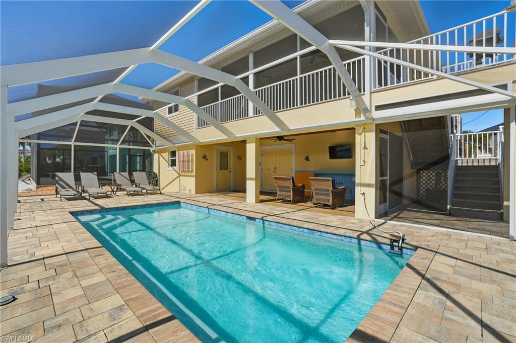 View of Pool, Patio, and Screened-in Lanai - Virtually Edited Image